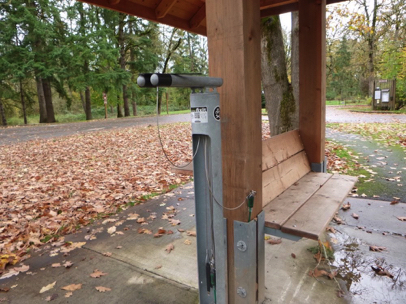 Bicycle repair station with tools and air pump located at the entrance of the campground – hard surface